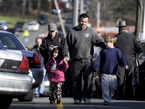 At Sandy Hook, parents and others lead children to safety and comfort.