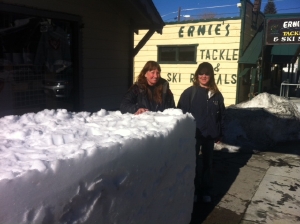 Pictured here, CANDACE LOGUE AND LESLEY MAIN stand beside the snow block for the Sierra Inn, where the party gets started on Friday evening!