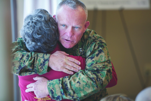 Major General Lawrence Nicholson hugs DSES Director Kathy Copeland.