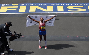 Meb Keflezighi of the US, celebrates after crossing the finish line to win the Men's Elite division of the 118th Boston Marathon in Boston, Massachusetts April 21, 2014 .  (TIMOTHY A. CLARY/AFP/Getty Images)