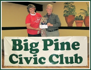 Photo (by Lisa Schade):  Sandy Lund, Big Pine Civic Club President with her Inyo County Animal Shelter adoptee, Charlie; and Ted Schade, ICARE President 