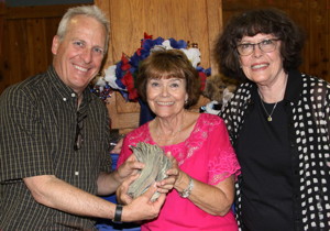 Photo by Ed Nahin: Ted Schade, ICARE President, Pat Olsen, 50/50 drawing winner for $1,500, and Patricia Nahin, Bishop Noon Rotary President