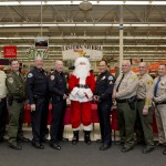 Representatives from most of the articipating agencies.  They are, left to right, Captain Rich Watt, US Forest Service; Lieutenant Bill Dailey, California Department of Fish and Wildlife; Chief Dan Watson, Mammoth Lakes Police Department; Chief Chris Carter, Bishop Police Department; Santa Claus; Sergeant Rick Moberly, Mammoth Lakes Police Department; Undersheriff Keith Hardcastle, Inyo County Sheriff’s Office; Sheriff Ralph Obenberger, Mono County Sheriff’s Office; and Captain Tim Noyes, Bishop CHP.   Photos are courtesy of Erin Gladding Photography.
