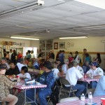 Half of the Big Pine population enjoys burgers, hot dogs with the traditional sides donated by Country Kitchen while the other half waits in line.   