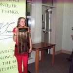 1st-place finisher Naiya Warren holding the winners plaque which has the names of the speech contest winners back to 1960. Owens Valley School will display the plaque until the 2016 speech contest.