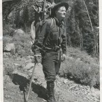 Norman Clyde with his trademark campaign hat, ice axe, pistol and back-breaking pack. Photo courtesy the Eastern California Museum. 