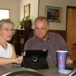 Prudence Carr gets individual attention from computer class instructor Charles James