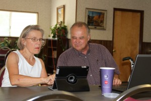 Prudence Carr gets individual attention from computer class instructor Charles James