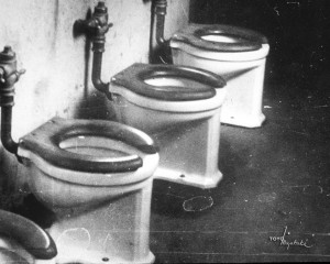 Photo Caption: Archie Miyatake photographed the interior of Manzanar’s Block 20 men’s latrine in 1944. Photo Credit: Toyo Miyatake Studio