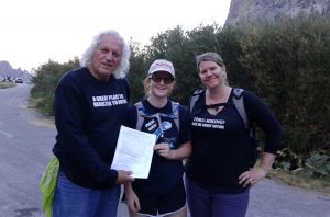 First time voter, Amelia Tracy, of Orange County CA registers to vote with Kammi Foote and Chuck Levin at the Kearsarge Pass trailhead at the end of a 10-hour day hike. 