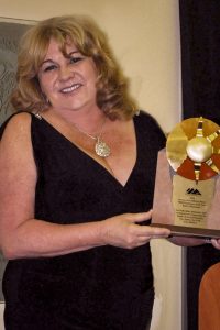 Quality and Infection Prevention Nurse Robin Christensen with her award for being the 2016 Northern Inyo Healthcare District Employee of the Year. Photo by Gayla Wolf/The Honey Bee