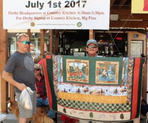 4th County District Supervisor Mark Tillemans congratulates Dana Vinciguerra of Huntington Beach. the proud winner of the Fishing Quilt Raffle. 2