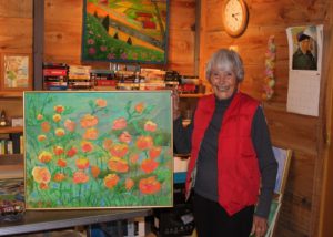 Betty Sisson shows one of her husbands painting inside his workshop. Note the Van Gogh calendar on the wall.