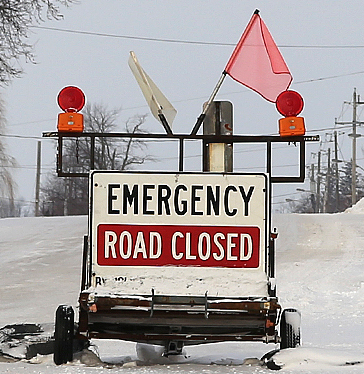 Road closed sign winter